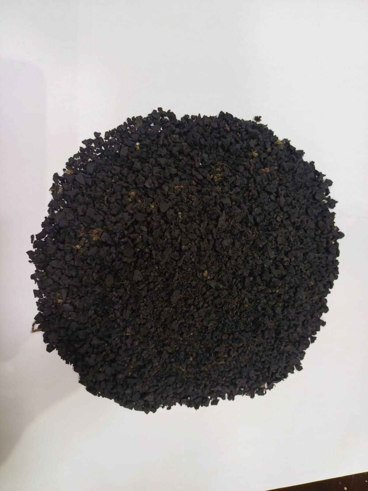 Close-up of rubber granules showing uniform particle shape